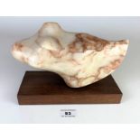 Alabaster sculpture by Peter Hibbard on wooden base, 9.5” long x 5” high, base 8.5” x 1”.