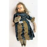 Antique wax-headed doll. Arm detached and damage to head. 19” long