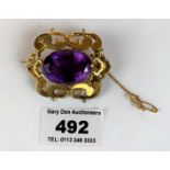 9k gold and purple stone brooch, w: 20gms, length 2”
