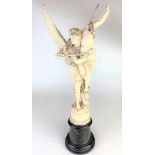 Fine quality carved ivory figure of guardian angel carrying wounded warrior on marble base. Figure