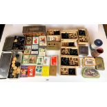 Box of assorted card games, chess pieces and old tins