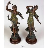 Pair of French winged spelter figures on wooden bases. 17” and 18” high. One has damaged finger
