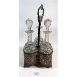 3 glass decanters in plated Mappin & Webb holder, bottles 11” high, holder 15” high. Bottles and