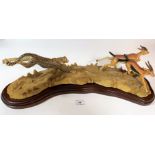 Teviotdale scene of leopard chasing deer by Tom Mackie, no. 59/750 on wooden plinth, 22” long x 6”