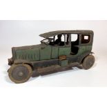 Tinplate metal car with driver. Steering wheel moves front wheels, windscreen lifts up and down,
