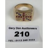 9k gold gents ring with red, white and blue stones in Union Jack flag design. W: 9.69 gms. Size R