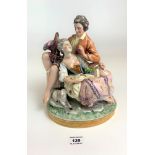 Bavarian porcelain group figure of lovers on rock 8” wide x 10” high