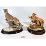 Country Artists lion and cubs on round wooden plinth 7” diameter, and Country Artists snow leopard