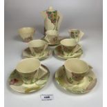 13pc Clarice Cliff part teaset pat no.762277-- 4 cups and saucers (1 cup cracked), teapot (chip to