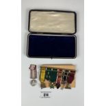 Bar brooch with 6 miniature medals and another miniature medal