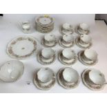36 piece unnamed china tea service including 11 cups, 11 saucers, 11 side plates, serving plate,