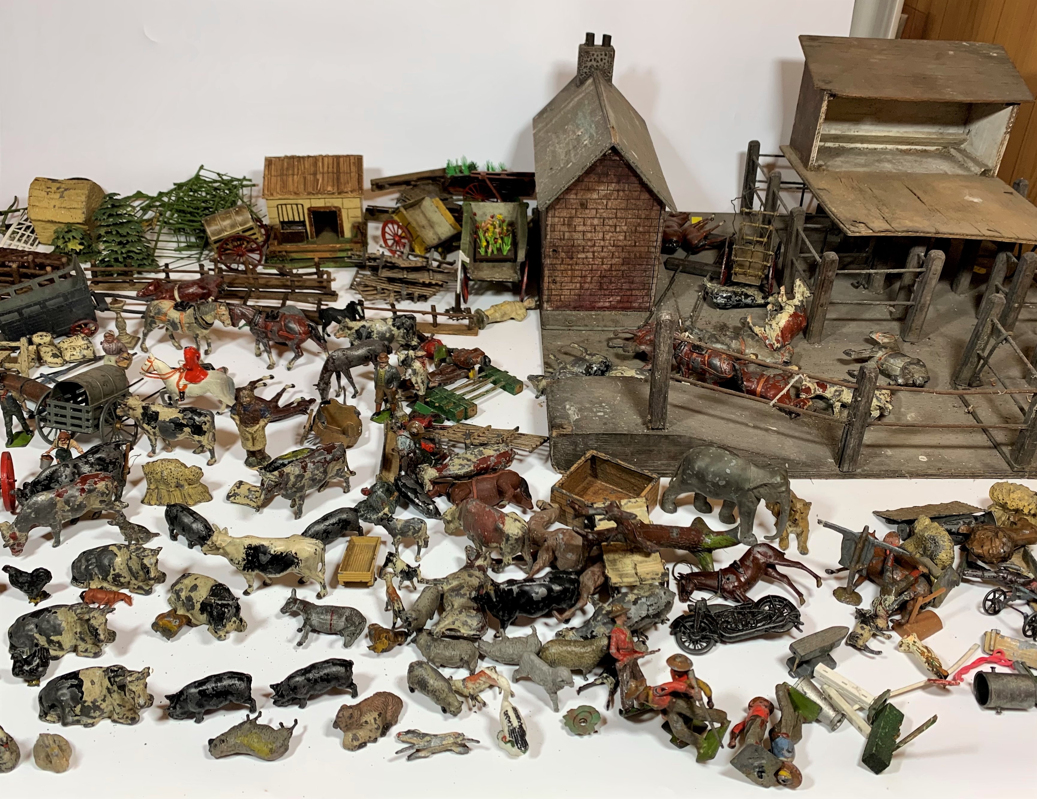 Wooden farmyard with buildings, accessories and animals. Farmyard measures 21” x 20” (possibly