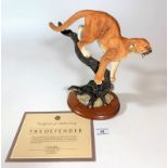 Franklin Mint ‘The Defender’, lion on branch on wooden plinth 6” long x 11” high with certificate.