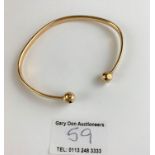 9k gold bangle, 8” circumference, w: 15.8 gms