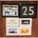 Framed number 25, framed Darwins Missing Link and folder of Euthymol advertising prints
