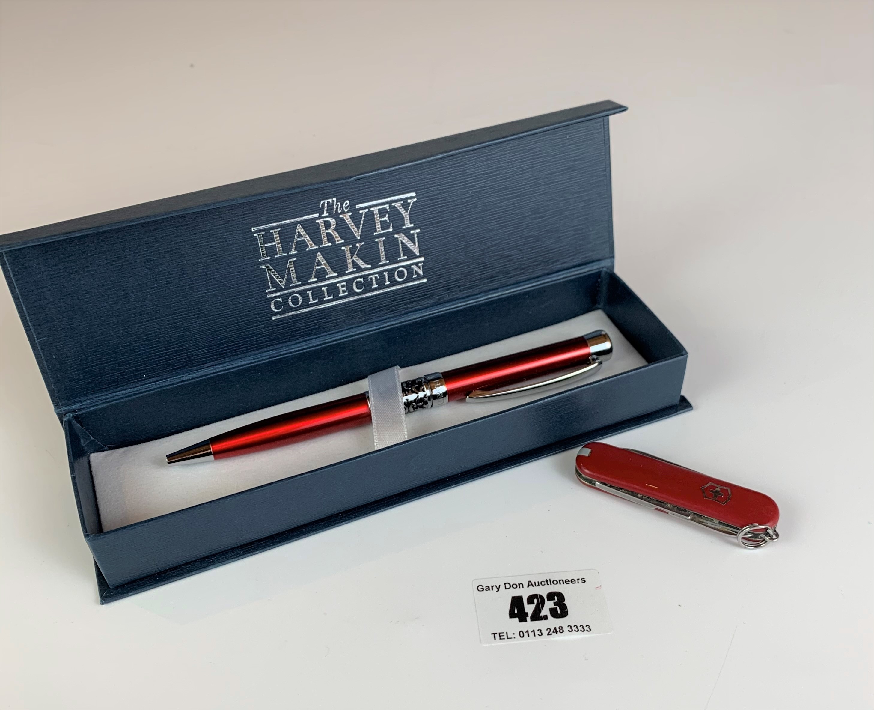 Boxed Harvey Makin ballpoint pen and Swiss army knife