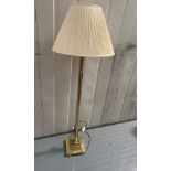 Brass standard lamp with cream shade