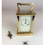 Brass carriage clock, 4.5” high plus handle. Has key but not working