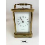 Brass carriage clock by Asprey & Sons, London. 5” high plus handle. Working with key.
