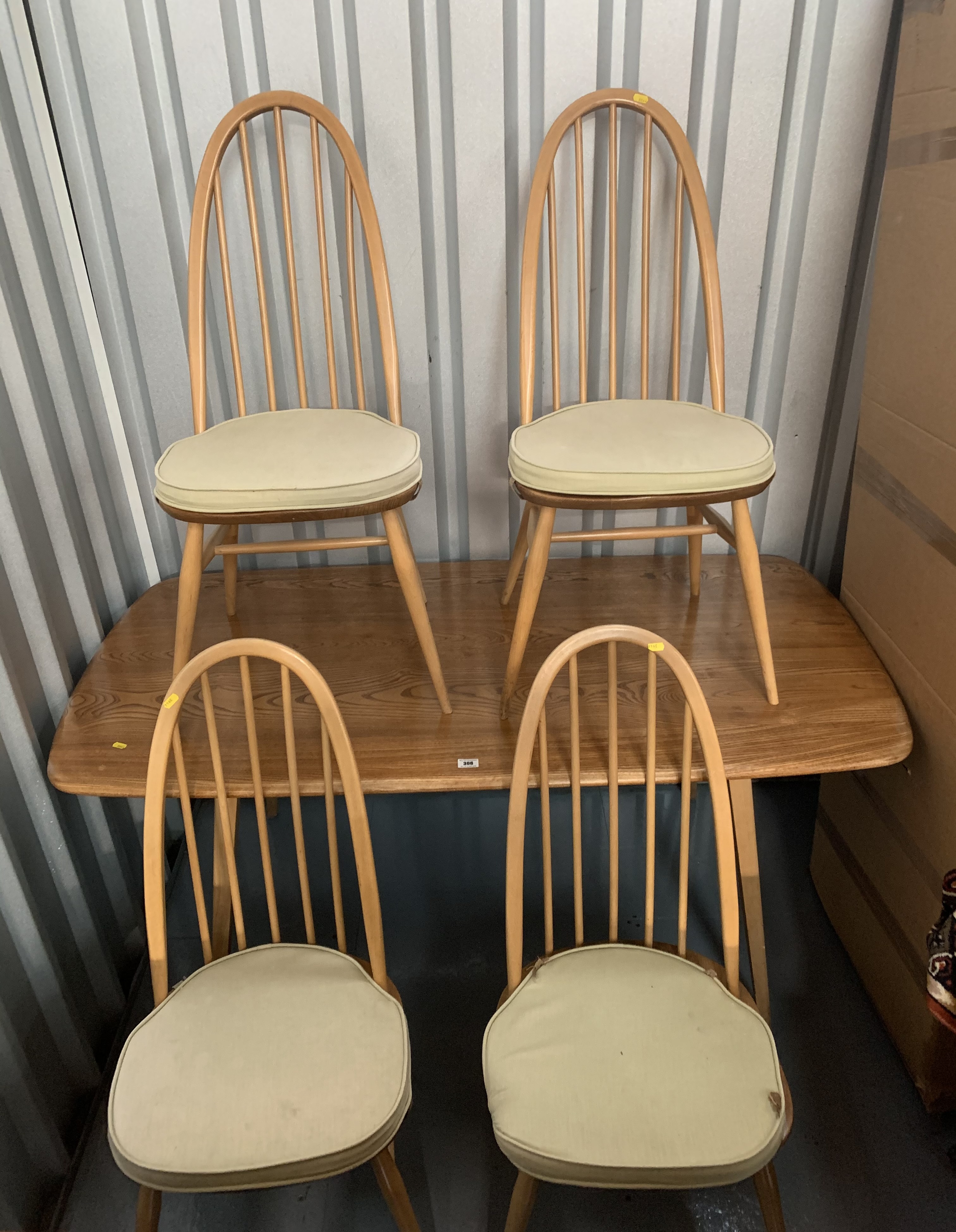 Blond Ercol dining table and 4 chairs. Table 60” long, 30” wide, 28” high