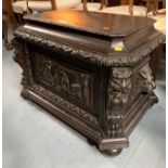 Carved oak cellarette with lead insert and lion handles. 28” wide, 23” deep, 22” high