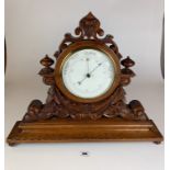 Barometer in carved wooden surround, 17” high, 21” wide