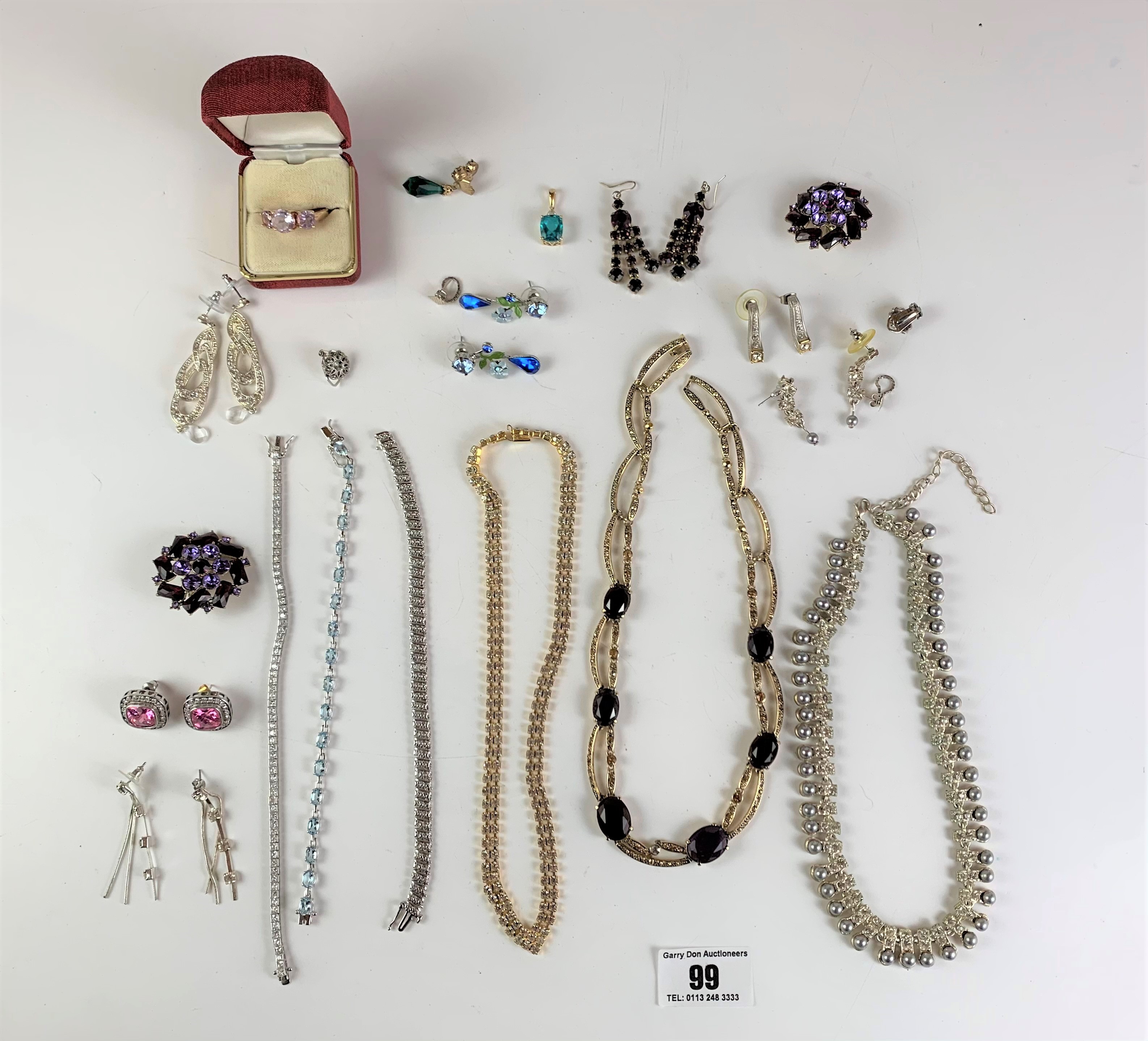 Bag of assorted dress jewellery including necklaces, earrings, brooches, ring etc.