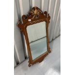 Chippendale style mahogany wall mirror with gilt ho-ho bird. 38” high, 21” wide