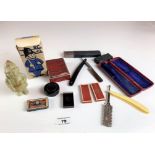 Assorted vintage razors and figure toilet soap