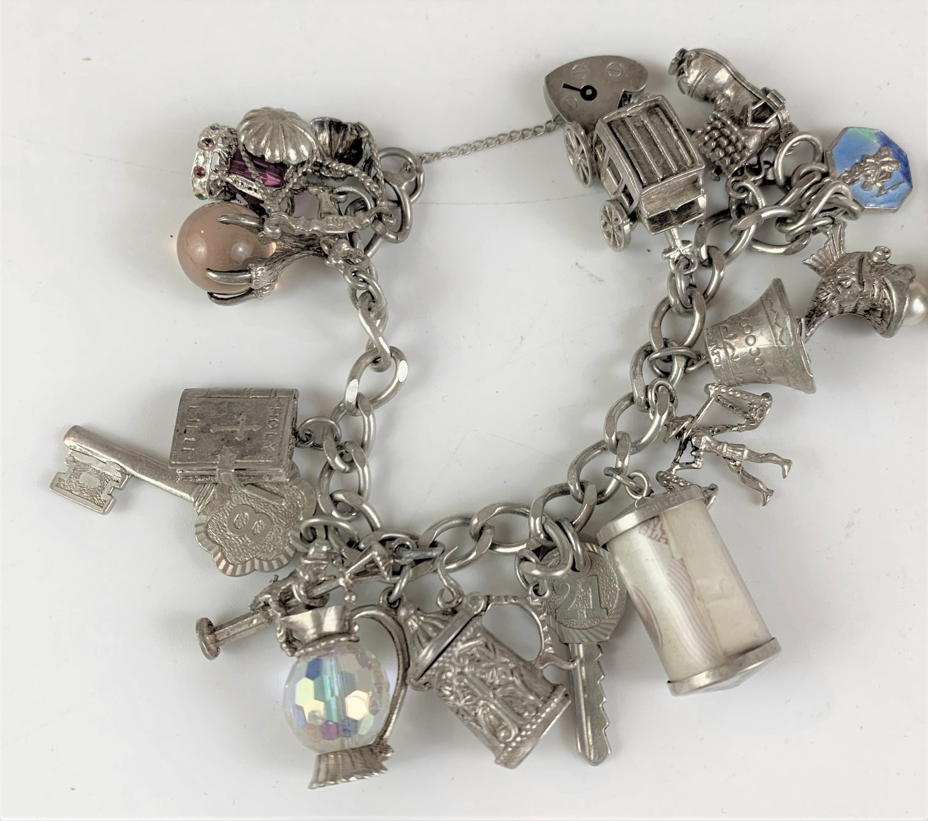 Silver charm bracelet with heart lock and 16 charms and additional boxed charm. - Image 4 of 10