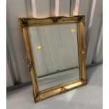 Gilt framed rectangular mirror. 23” x 19”