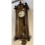 Early Vienna wall clock with key and pendulum in walnut and ebonised case. 8 day striking