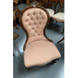 Mahogany nursing chair with pink deep buttoned upholstery