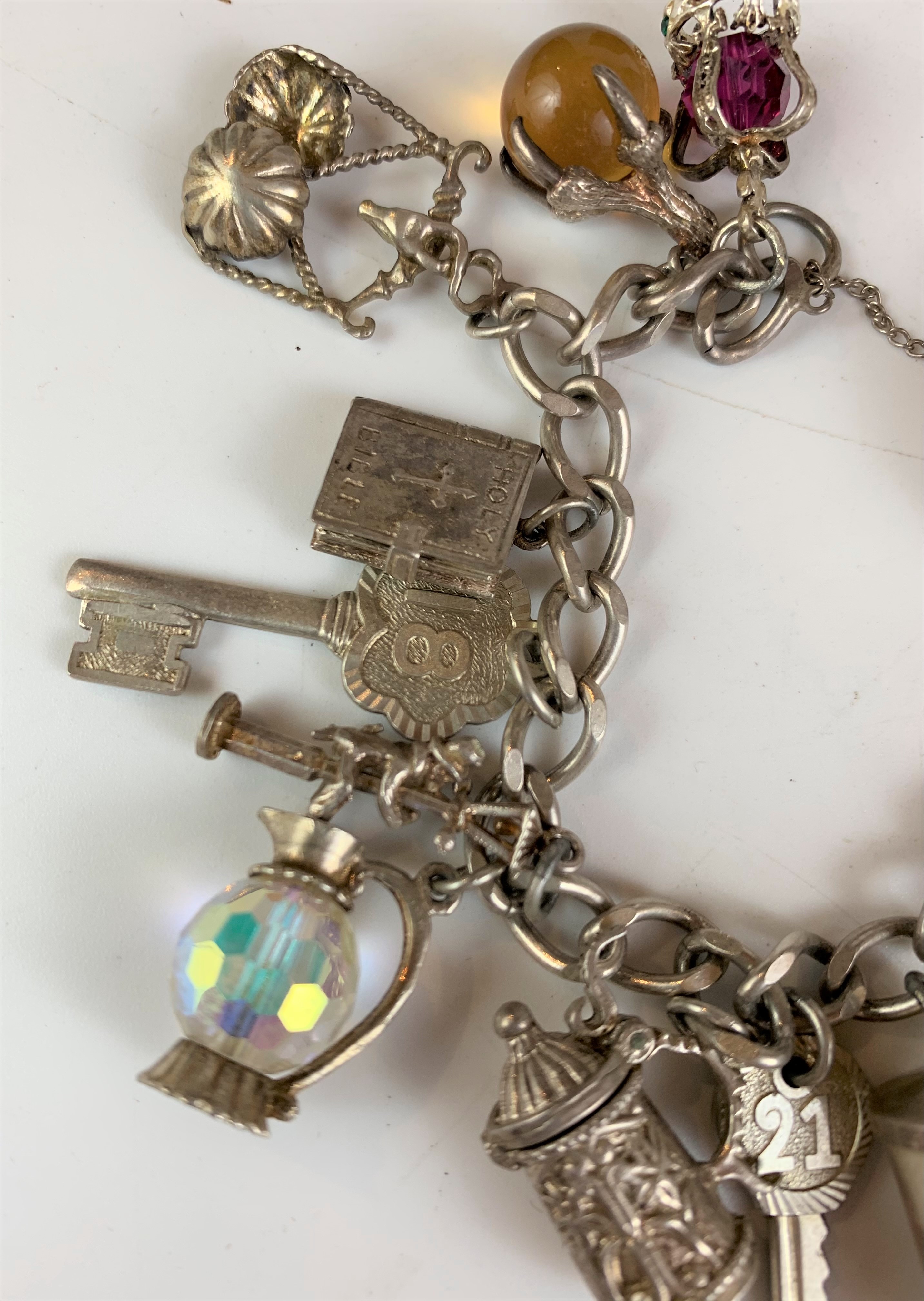 Silver charm bracelet with heart lock and 16 charms and additional boxed charm. - Image 6 of 10