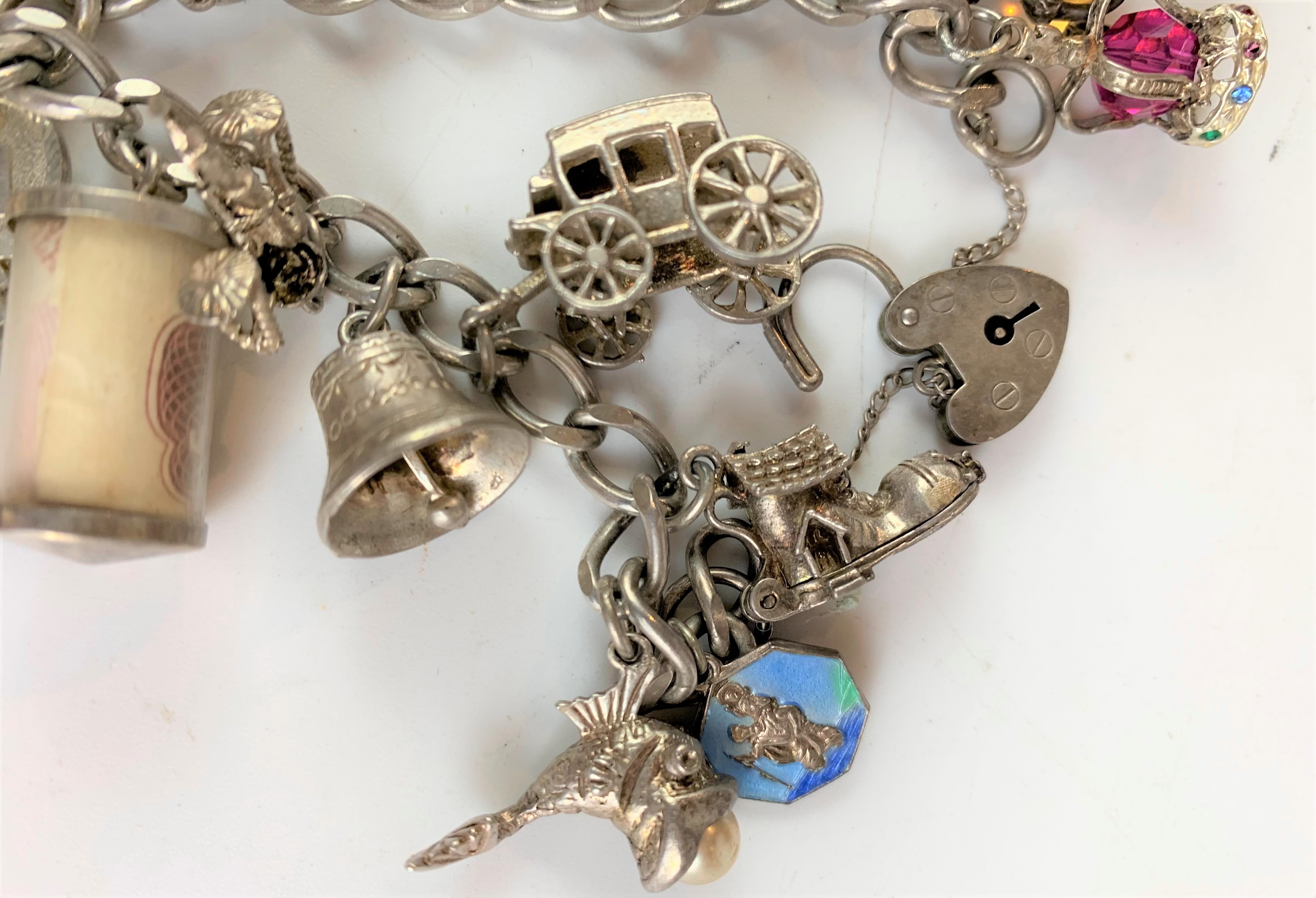 Silver charm bracelet with heart lock and 16 charms and additional boxed charm. - Image 8 of 10