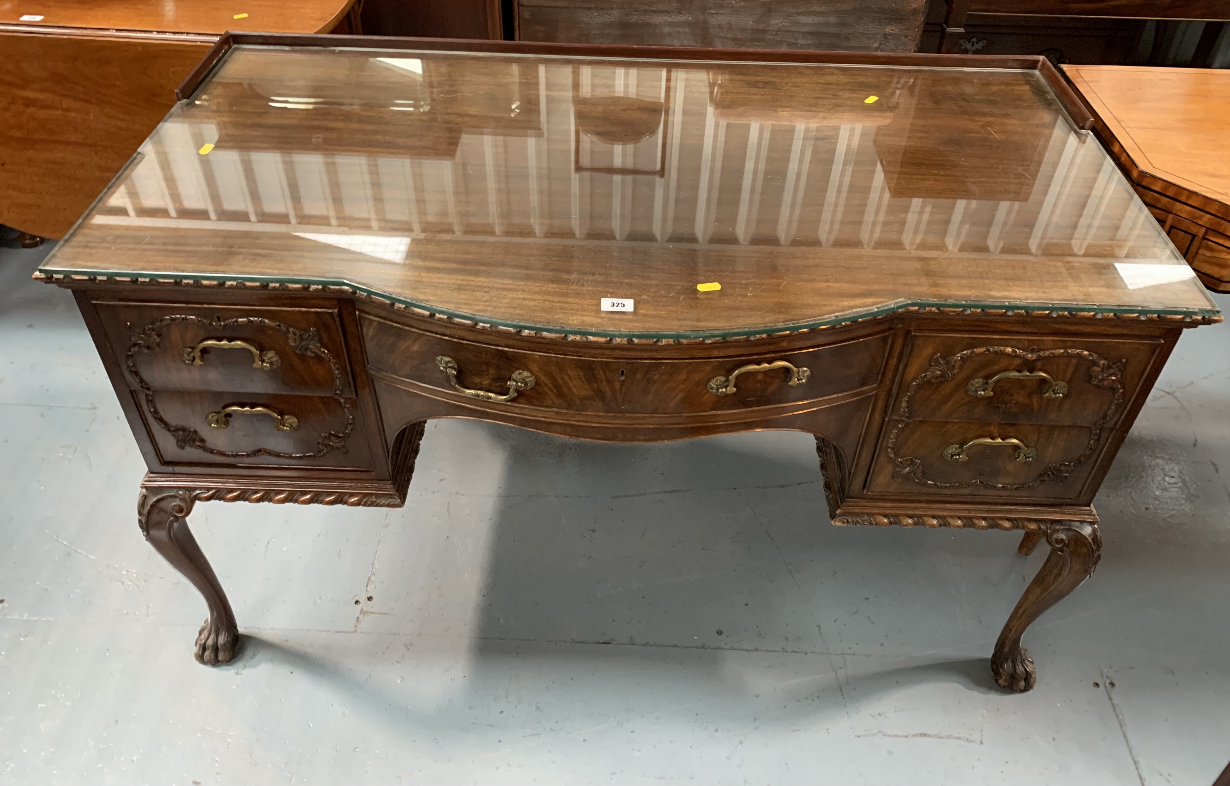 Bow fronted claw/ball foot sideboard with glass top and 5 drawers 50” wide, 26” deep, 31” high