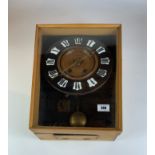 Unusual wall clock by J & T Wilkinson, Leeds with pendulum and key, 15” high x 13” wide