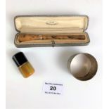 Boxed amber cigarette holder, miniature amber cigarette lighter and plated napkin ring