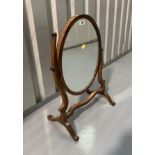 Oval swing dressing table mirror. 23” high, 15.5” wide, 9.5” deep