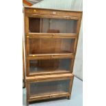 4 heights Globe Wernicke style bookcase by Gunn, 64” high, 34” wide, 12” base deep