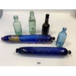 2 blue glass rolling pins and 4 old glass bottles