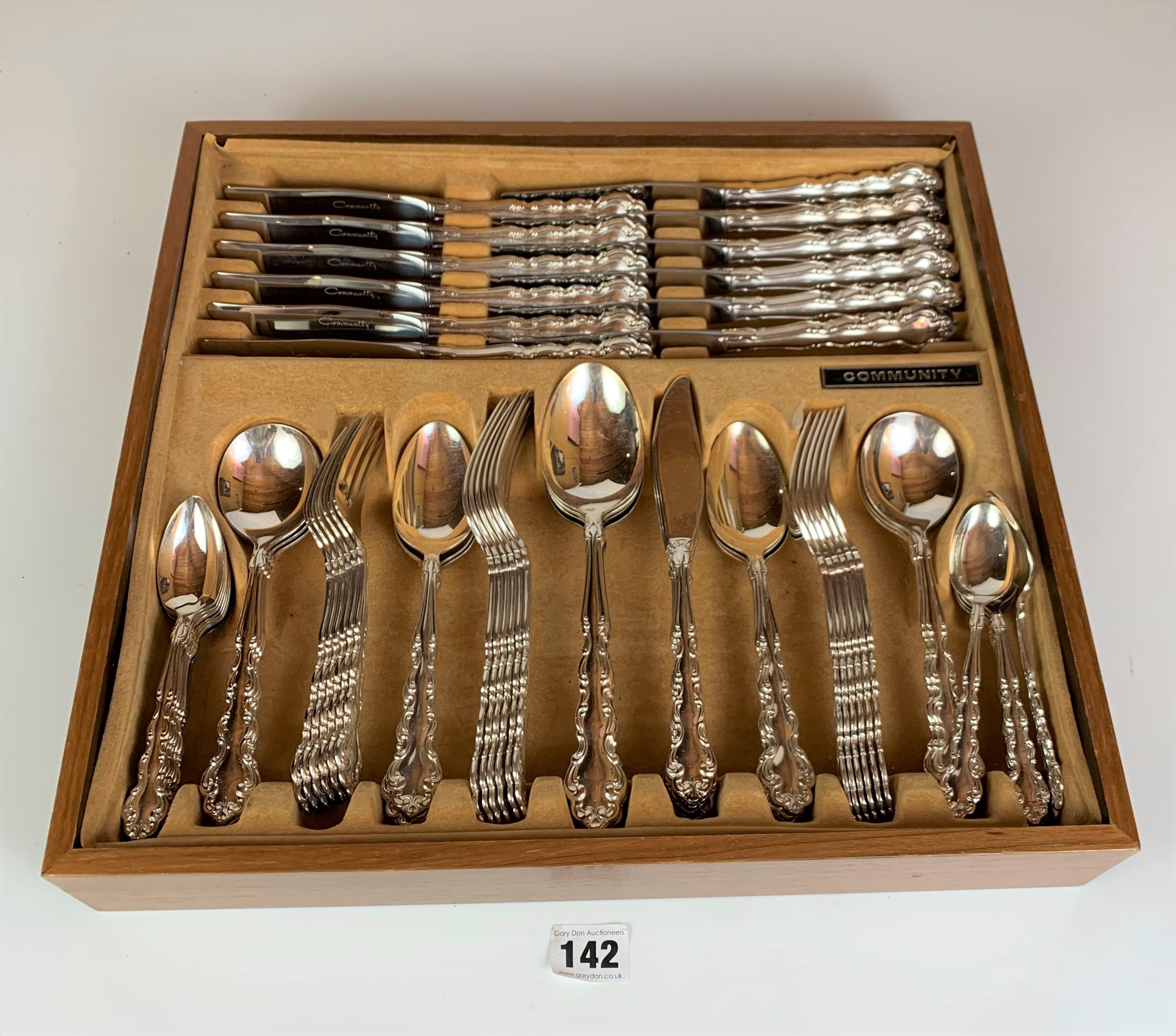 Cutlery drawer containing full set of 64 pieces of Community stainless steel cutlery