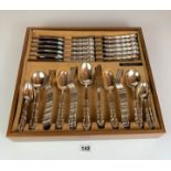 Cutlery drawer containing full set of 64 pieces of Community stainless steel cutlery