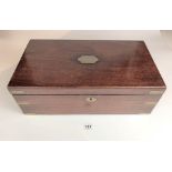 Mahogany writing box with green baize interior and one glass inkpot. Brass carrying handles. 18”