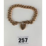 9k gold link bracelet with heart lock, length 8”, w: 16.8 gms