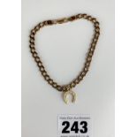 9k gold bracelet with horseshoe charm, length 8”, w: 10.7 gms