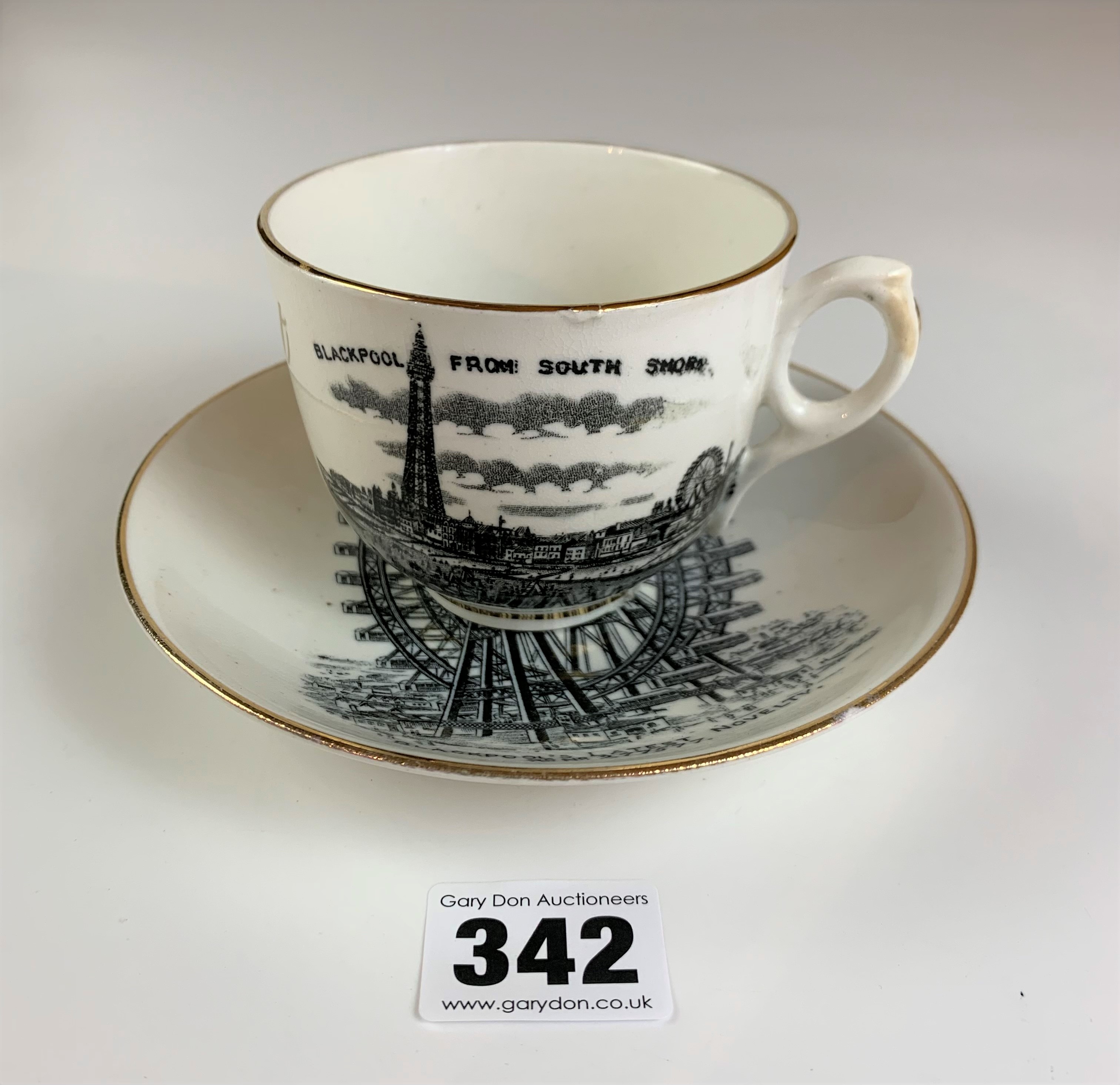 Souvenir from Blackpool cup and saucer ‘ A present for my brother’ with scenes of The Great Wheel,