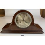 Wooden 2 hole Napoleon hat cased mantle clock with silvered dial, pendulum and key. 17” long x 9.