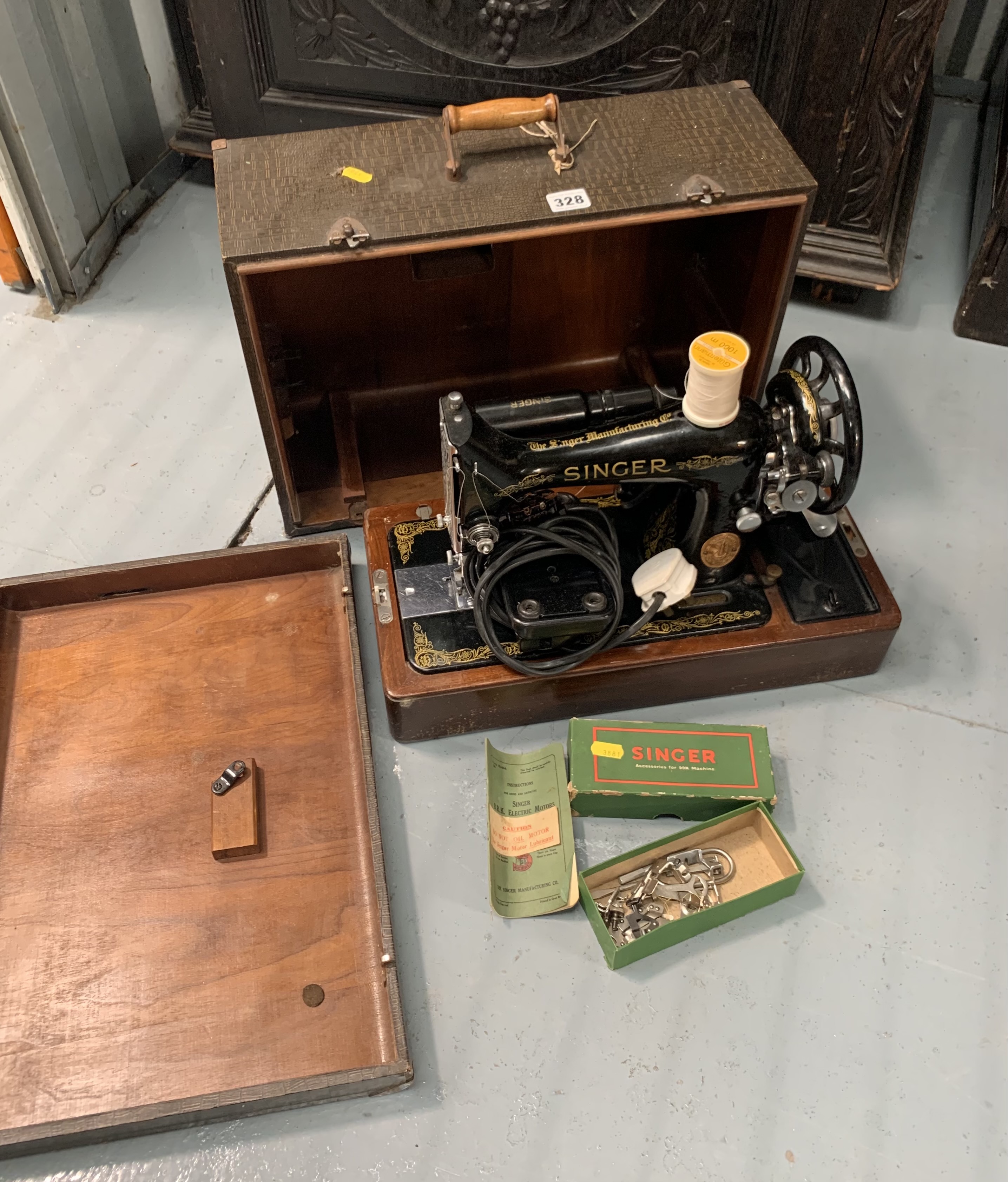 Singer sewing machine in case with accessories