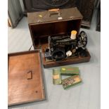 Singer sewing machine in case with accessories